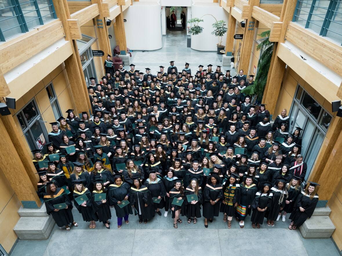 UNBC class of 2022 attends an in-person graduation ceremony in May. On Friday, the university will organize an in-person make-up ceremony for the classes of 2020 and 2021. (University of Northern British Columbia - image credit)