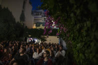 In this Tuesday June 2, 2020 photo people watch "I would rather not" by stand-up comedians Vironas Theodoropoulos and Michalis Mathioudakis at the Panathinea outdoor cinema, in Neapoli, central Athens. (AP Photo/Petros Giannakouris)