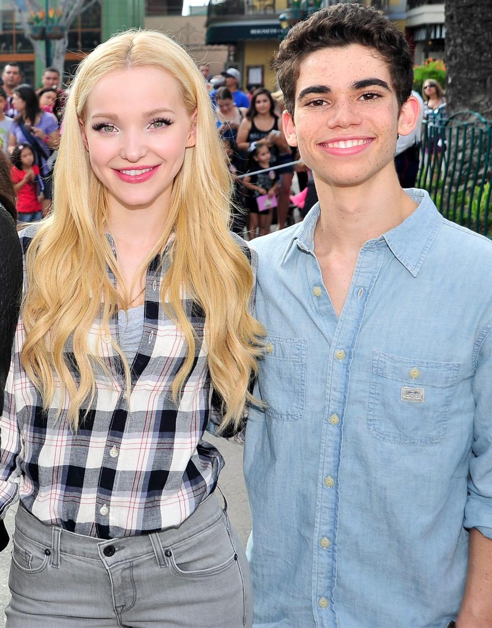 Dove Cameron and Cameron Boyce of Disney's 'Descendants' perform and join fans at Downtown Disney at Disneyland Resort on October 17, 2015 in Anaheim, California.