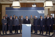 FILE - In this July 7, 2005, file photo British Prime Minister Tony Blair, center, speaks during a group photo of G8 and other leaders at the G8 summit at the Gleneagles Hotel in Auchterarder, Scotland. Explosions on London's transport system killed dozens of people and caused chaos in the British capital at rush hour that morning. Standing left of Blair is U.S. President George W. Bush and right is French President Jacques Chirac. For the 45th year in a row, seven of the most powerful people in the world will get together Saturday through Monday for an informal but influential summit. (Charlie Bibby/Financial Times via AP, Pool)