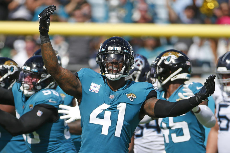 Jacksonville Jaguars outside linebacker Josh Allen (41) celebrates after sacking Tennessee Titans quarterback Ryan Tannehill during the second half of an NFL football game, Sunday, Oct. 10, 2021, in Jacksonville, Fla. (AP Photo/Stephen B. Morton)