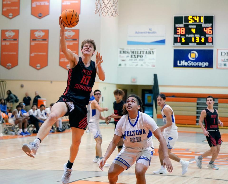 New Smyrna Beach's Lukas Parschauer (10) drives to the basket for a layup during a game with Deltona at University High School, in Orange City, Wednesday, Jan. 24, 2024.