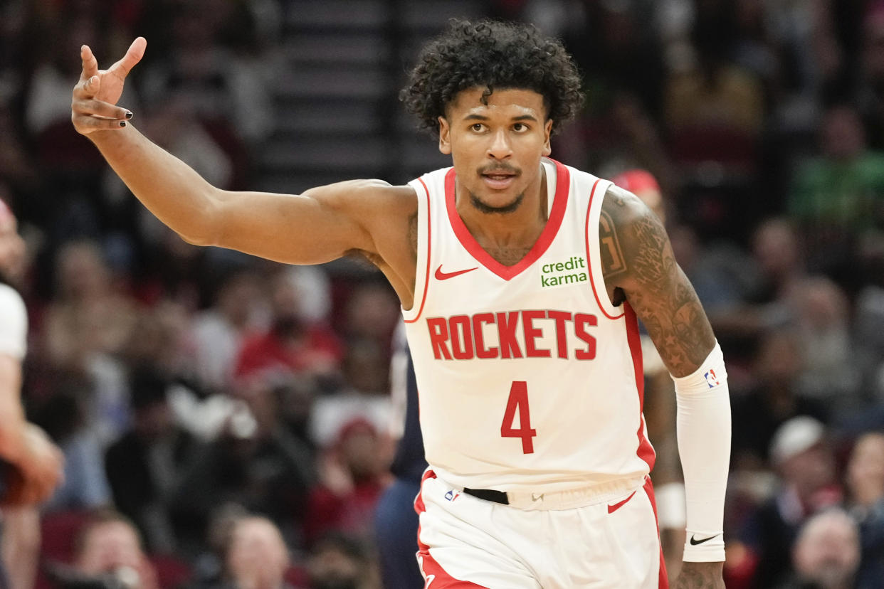 Houston Rockets guard Jalen Green (4) reacts after making a three point basket against the New Orleans Pelicans during the second half of an NBA basketball game Wednesday, Jan. 31, 2024, in Houston. (AP Photo/Eric Christian Smith)