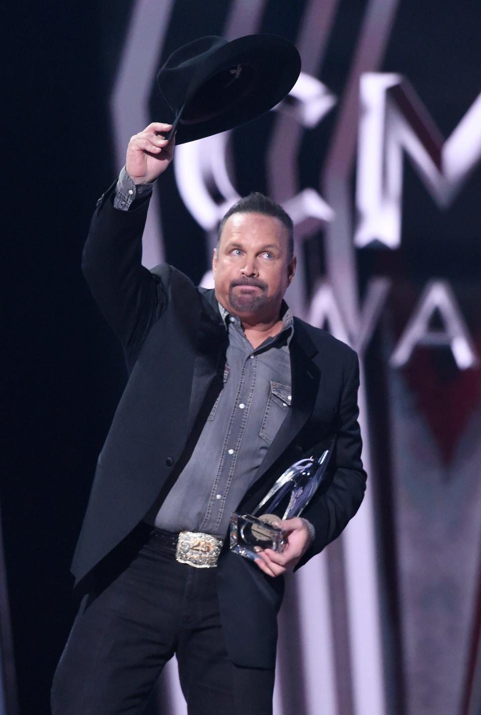 Garth Brooks holds the Entertainer of the Year Award at the 53rd Annual CMA Awards at Bridgestone Arena Wednesday, Nov. 13, 2019 in Nashville, Tenn.

