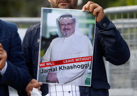 A demonstrator holds picture of Saudi journalist Jamal Khashoggi during a protest in front of Saudi Arabia's consulate in Istanbul, Turkey, October 5, 2018. REUTERS/Osman Orsal