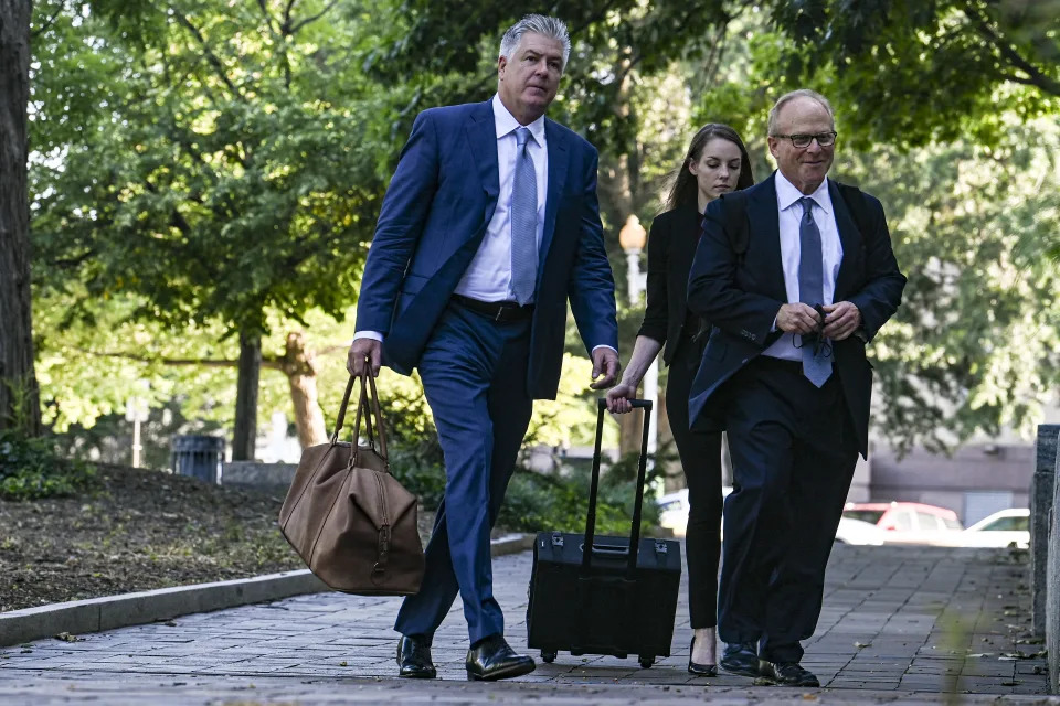 Attorneys M. Evan Corcoran, left, and David Schoen arrive to represent Steve Bannon on contempt of Congress charges, in Washington on July 20, 2022. (Kenny Holston/The New York Times)