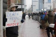 Joe Kebartas holds a sign reading "Death Penalty is Murder" outside the trial of accused Boston Marathon bomber Dzhokhar Tsarnaev in Boston, Massachusetts, March 4, 2015. REUTERS/Brian Snyder (UNITED STATES - Tags: CRIME LAW)