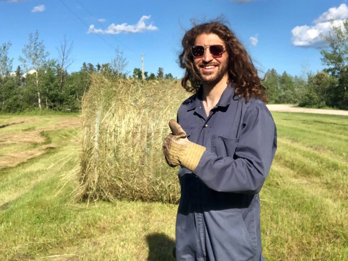 Jamal Abas, 30, is one of a growing number of young farmers in Manitoba. A recent Statistics Canada report says the province has the highest proportion of farm operators under 35 in Canada. (Jamal Abas/Twitter - image credit)