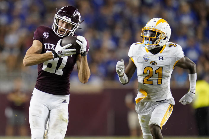 Texas A&M wide receiver Caleb Chapman (81) catches a pass as Kent State cornerback Montre Miller (21) defends during the during the second half of an NCAA college football game on Saturday, Sept. 4, 2021, in College Station, Texas. (AP Photo/Sam Craft)