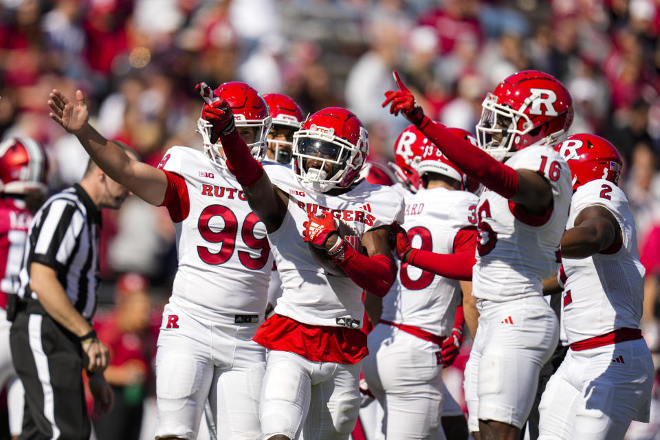 Rutgers defensive back Robert Longerbeam, center, celebrates a fumble recovery against Indiana during the first half of an NCAA college football game in Bloomington, Ind., Saturday, Oct. 21, 2023. (AP Photo/Michael Conroy)