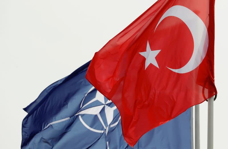 NATO and Turkish flags flutter at the Alliance headquarters in Brussels