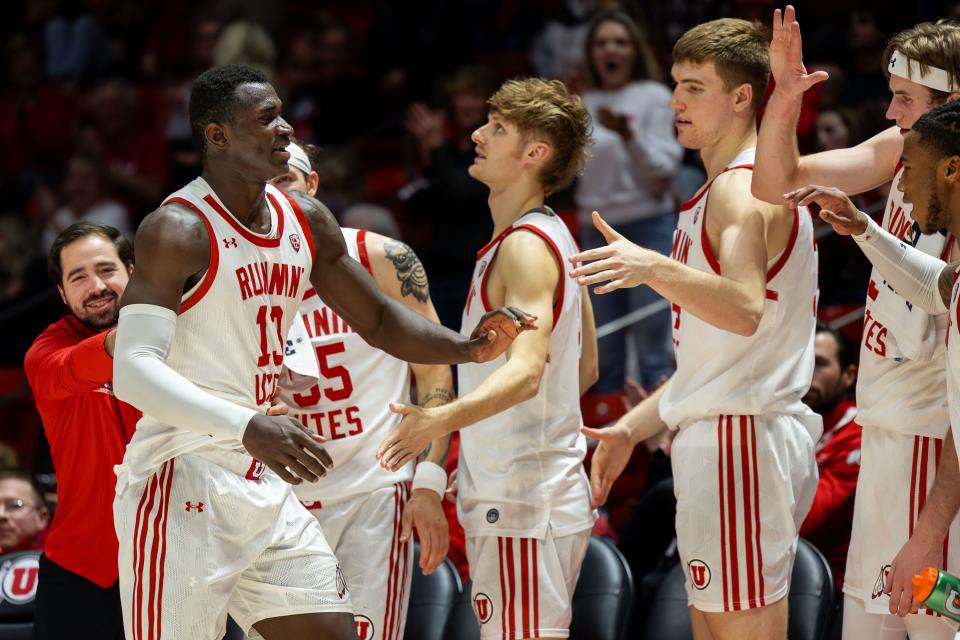 Utah Utes players cheer on Utah Utes center Keba Keita (13) as he comes off the court after their victory over Washington State University in a men’s college basketball game at the Jon M. Huntsman Center in Salt Lake City on Friday, Dec. 29, 2023. The Utes won the game 80-58. | Megan Nielsen, Deseret News
