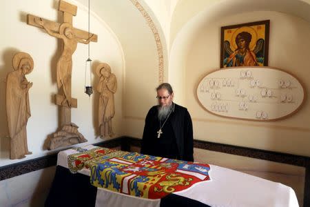 A church official stands next to the tomb of Princess Alice of Battenberg, buried inside the Russian Orthodox church of St. Mary Magdalene on the Mount of Olives in Jerusalem, June 14, 2018. Picture taken June 14, 2018. REUTERS/Ammar Awad