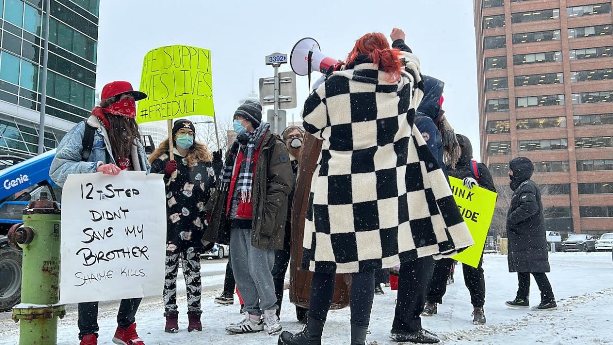 Starting at Central Memorial Park, safe supply supporters marched through downtown to the Calgary Courts Centre Tuesday, calling on the province for safe drug supply. (Karina Zapata/CBC - image credit)