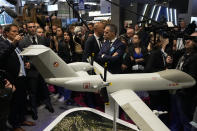 Jordan Bardella, second left, president of the far-right National Front party, looks at replica of an Airbus large long endurance Eurodrone at the Eurosatory Defense and Security exhibition, Wednesday, June 19, 2024 in Villepinte, north of Paris. Jordan Bardella, hoping to become France's prime minister, appealed Tuesday to voters to hand his party a clear majority after French President Emmanuel Macron's announcement on June 9 that he was dissolving France's National Assembly, parliament's lower house.( AP Photo/Michel Euler)