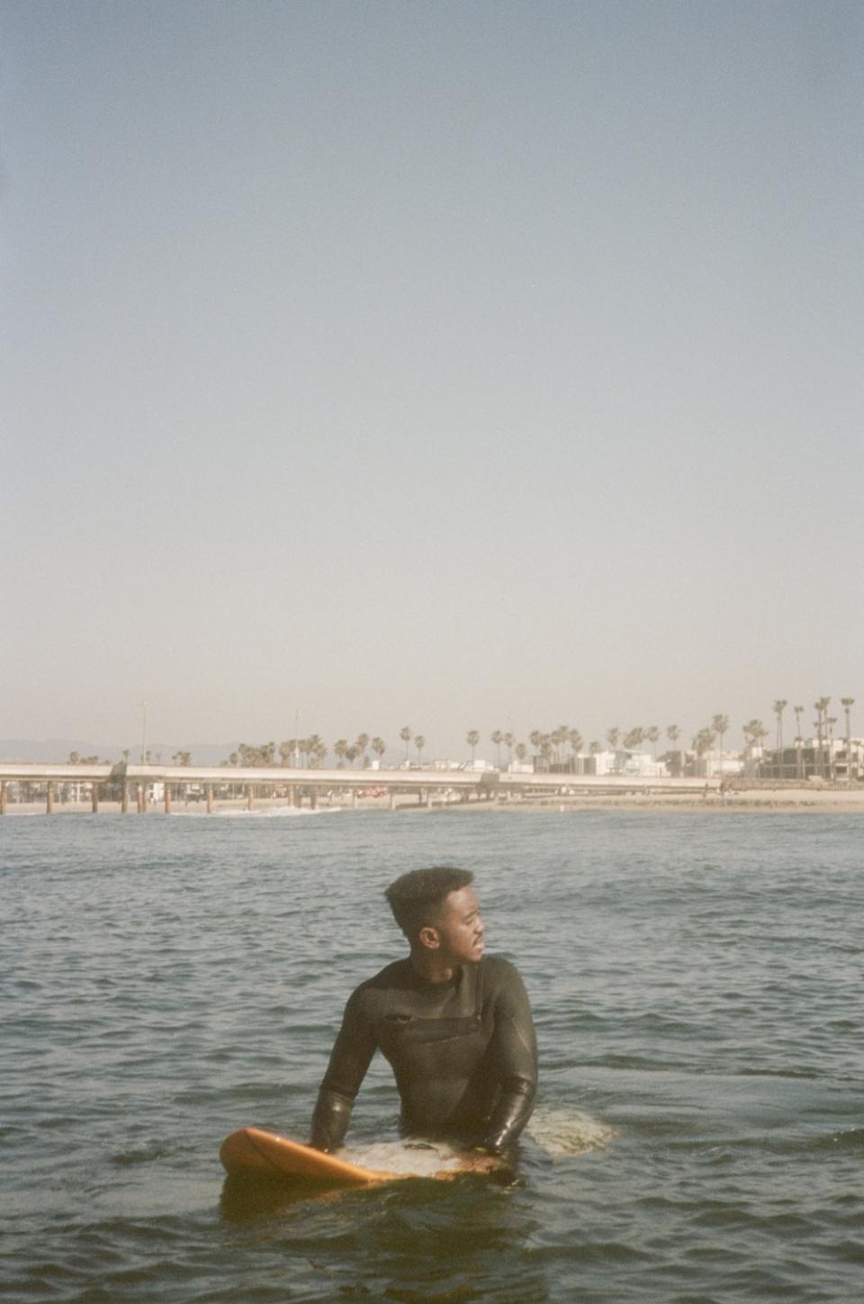 Brick Howze waits for a wave during a morning surf session on Saturday, March 13, 2021.