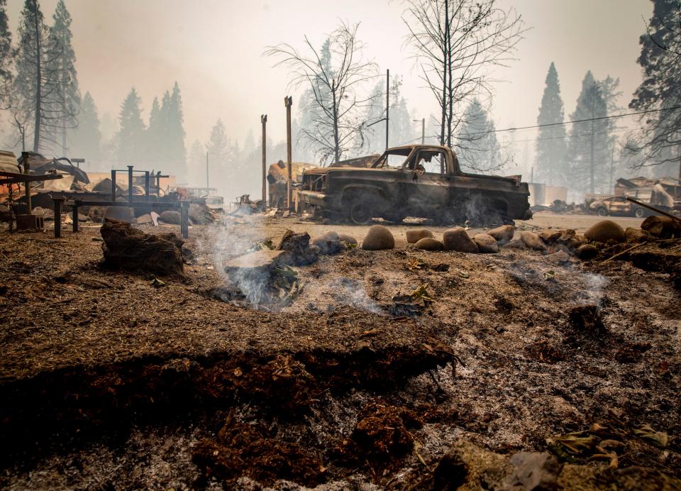 The ground was still smoking eight days after the Holiday Farm Fire swept through the business district in Blue River in September 2020.
