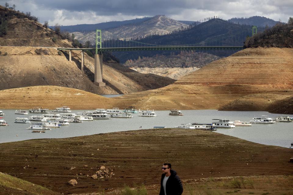 FILE - Houseboats float on Lake Oroville on Oct. 25, 2021, in Oroville, Calif. Months of winter storms have replenished California's key reservoirs after three years of punishing drought. (AP Photo/Noah Berger, File )