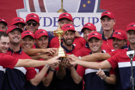 Team USA players and captains pose with the trophy after the Ryder Cup matches at the Whistling Straits Golf Course Sunday, Sept. 26, 2021, in Sheboygan, Wis. (AP Photo/Ashley Landis)