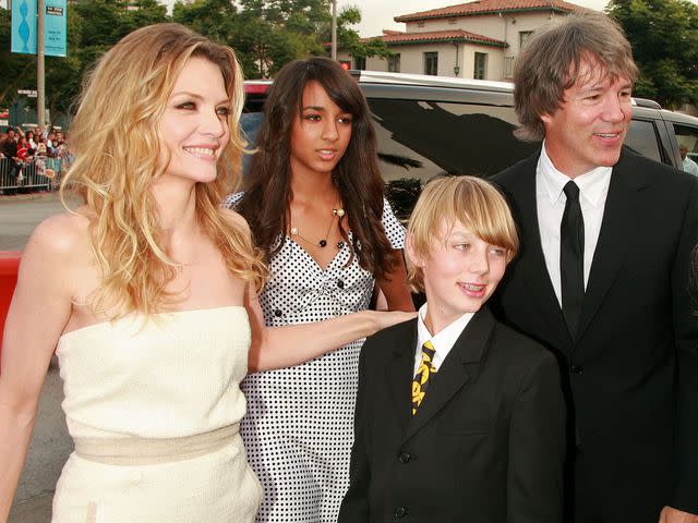 <p>Kevin Winter/Getty</p> Michelle Pfeiffer, Claudia Kelley, John Kelley and David E. Kelley arrive at the 2007 premiere of 'Hairspray'