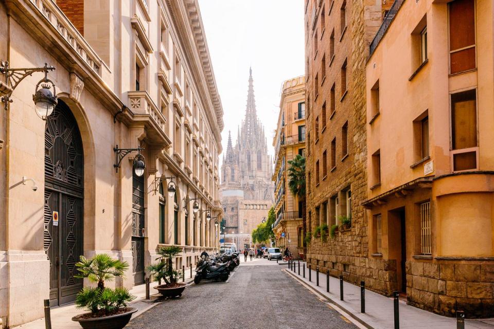 street in barcelona with barcelona cathedral in the center, barcelona, spain