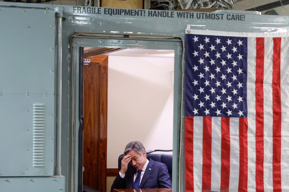 U.S. Secretary of State Antony Blinken sits onboard the plane during his visit to Israel as he departs en route to Jordan, Friday, Nov. 3, 2023.