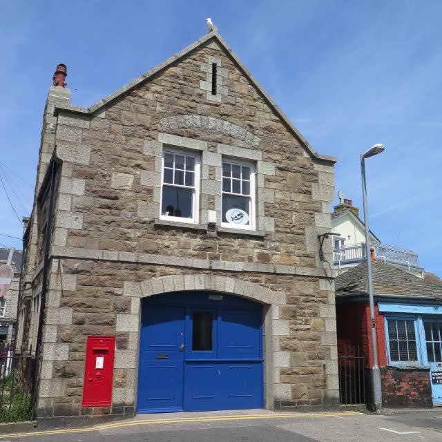 The former Admiralty Boat House in Newlyn, Cornwall (Historic England/PA)