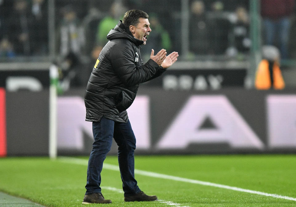 Moenchengladbach coach Dieter Hecking reacts during the German Bundesliga soccer match between Borussia Moenchengladbach and Hannover 96 at the Borussia Park in Moenchengladbach, Germany, Sunday, Nov. 25, 2018. (AP Photo/Martin Meissner)