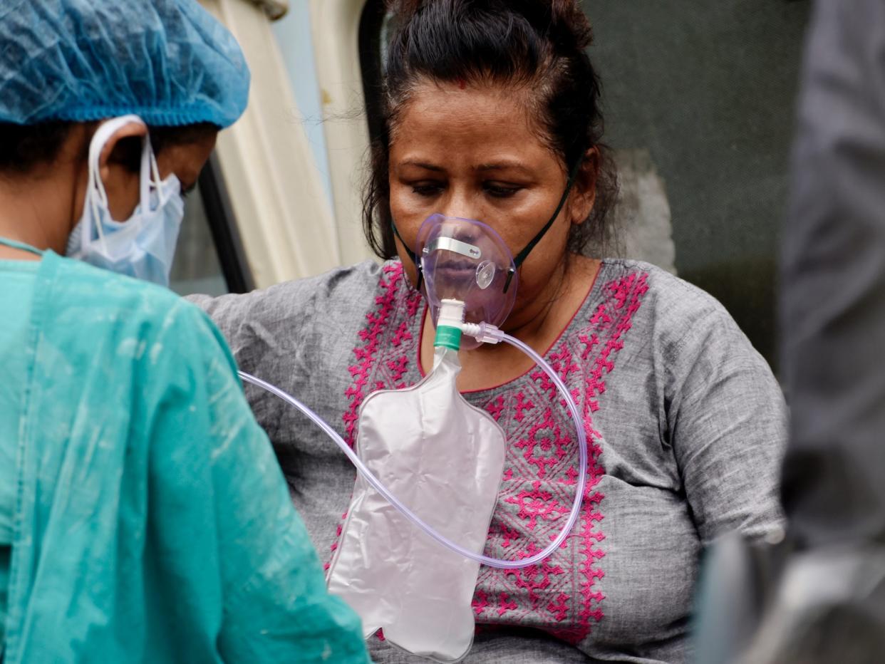 A Covid-19 patient gets admitted to a government hospital in Kolkata, India, 22 April, 2021. India reported 314,835 fresh coronavirus infections on Thursday according to an Indian media report.