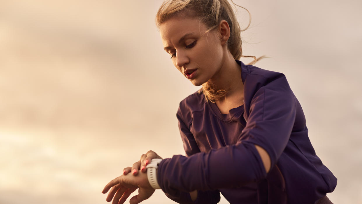  Woman checking sports watch 