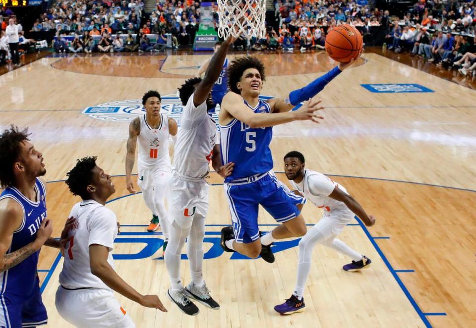 Duke’s Tyrese Proctor (5) drives to the basket past Miami’s Bensley Joseph (4) during Duke’s 85-78 victory over Miami in the semifinals of the ACC Men’s Basketball Tournament in Greensboro, N.C., Friday, March 10, 2023.