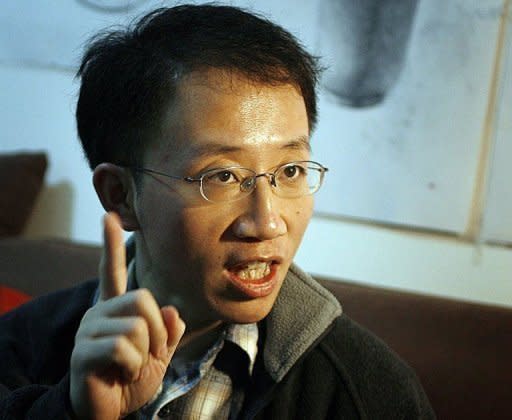 Prominent Chinese dissident Hu Jia, pictured here in 2007, said he wants to resume his activism but was weighing the impact on his family in his first reported comments after being discharged from prison at the weekend