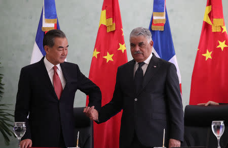 China's Foreign Minister Wang Yi and Dominican Republic's Chancellor Miguel Vargas shake hands after signing a bilateral agreement in Santo Domingo, Dominican Republic September 21, 2018. REUTERS/Ricardo Rojas