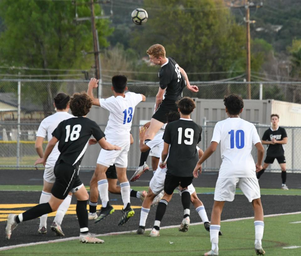 Newbury Park's Philip Kleeman heads home a corner kick for a goal during the Panthers' 2-0 win over visiting Fillmore in a Division 4 wild-card match on Wednesday, Feb. 9, 2022.