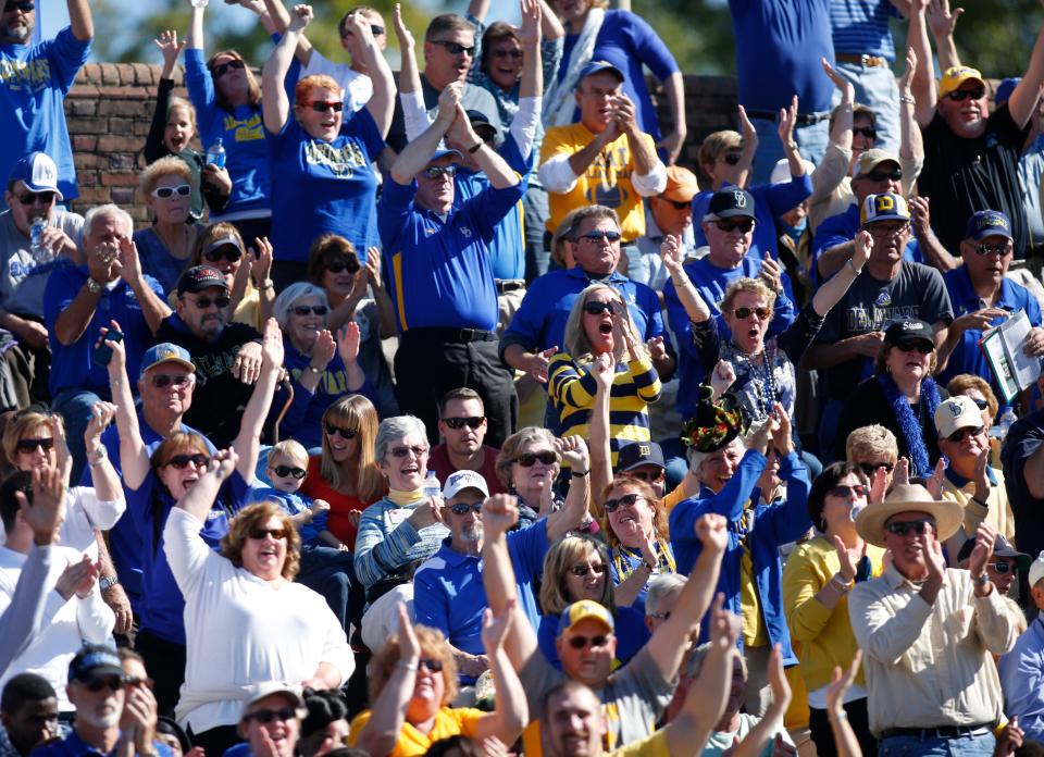 The Hens faithful cheer after Delaware got on the board with a 31-yard touchdown reception to Jerel Harrison in the second quarter at Zable Stadium in Williamsburg, Va., Saturday, Oct. 25, 2014.