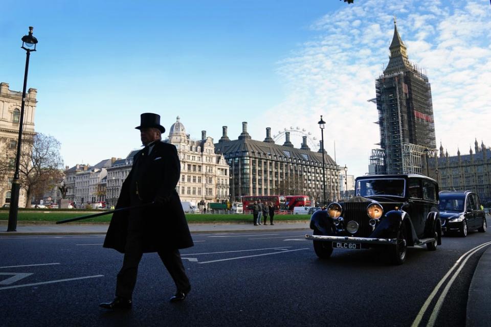 The hearse carrying the coffin of Sir David Amess MP crosses Parliament Square after leaving the Palace of Westminster (Victoria Jones/PA) (PA Wire)