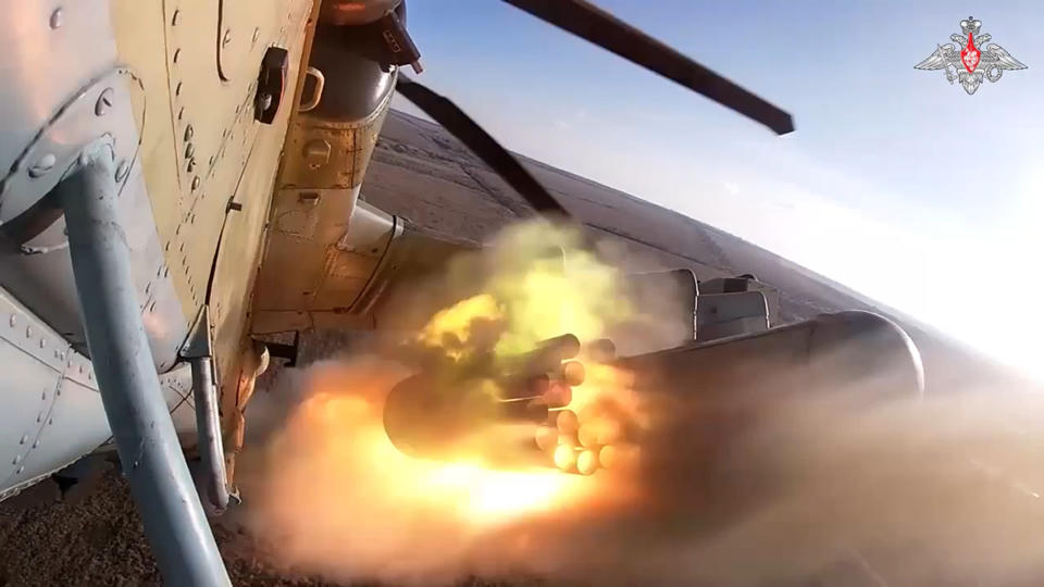 In this photo taken from video released by the Russian Defense Ministry Press Service on Wednesday, Dec. 13, 2023, a Ka-52 helicopter gunship of the Russian air force fires rockets at a target at an unknown location in Ukraine. After blunting Ukraine's counteroffensive from the summer, Russia is building up its resources for a new stage of the war over the winter, which could involve trying to extend its gains in the east and deal significant blows to the country's vital infrastructure. Russia has ramped up its pressure on Ukrainian forces on several parts of the more than 1,000-kilometer (620-mile) front line. (Russian Defense Ministry Press Service via AP)