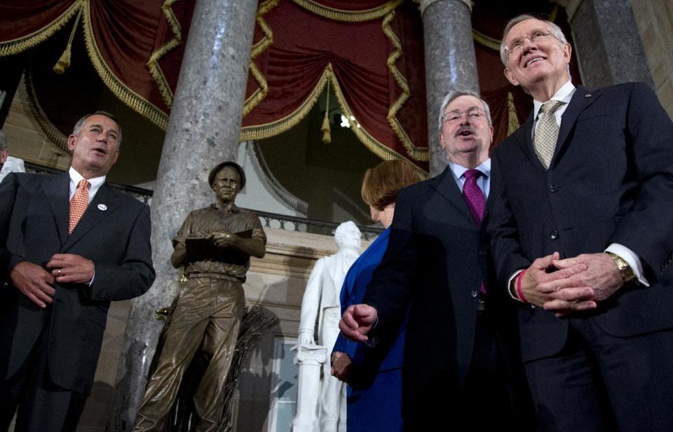 From left, House Speaker John Boehner of Ohio, Jeanie Borlaug Laube, daughter of Dr. Norman E. Borlaug, Iowa Gov. Terry Branstad and Senate Majority Leader Harry Reid of Nev., stand together in Statuary Hall on Capitol Hill in Washington, Tuesday, March 25, 2014, in front of a statue of the late Dr. Norman E. Borlaug during its dedication ceremony. Dr. Borlaug, an Iowa native, is known as the “Father of The Green Revolution” and his development of "miracle wheat" is credited with saving an estimated billion people around the world from hunger and starvation. He is the only American to receive the Nobel Peace Prize, the Congressional Gold Medal, the Presidential Medal of Freedom and the National Medal of Science. (AP Photo/Carolyn Kaster)