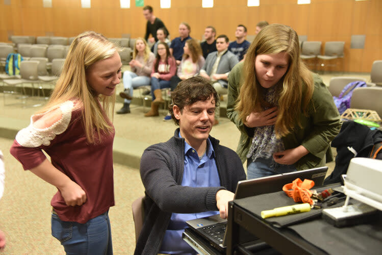 Senior Chloe Case (Class of 2017) , social studies teacher Todd Cammarata, and junior Chloe Makdad (Class of 2018), work on a presentation in the large group instruction room at Tyrone Middle and High School in Tyrone, PA. (Ellie Oakes)