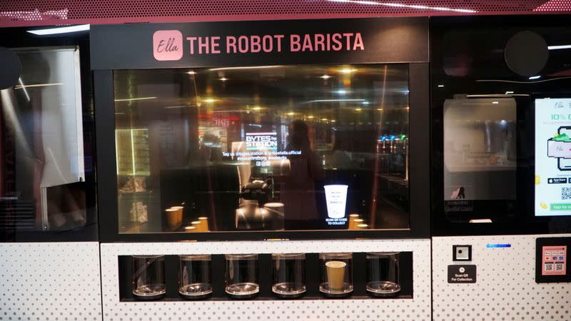 Robot barista "Ella", designed by Crown Digital, makes a coffee autonomously after receiving orders, in Singapore