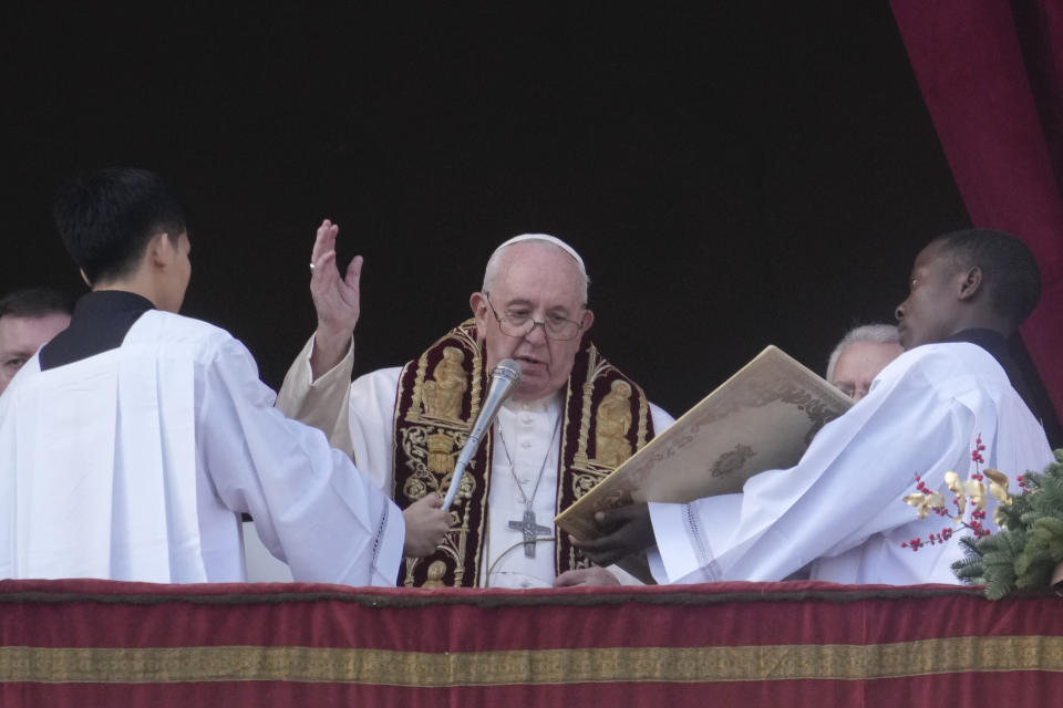 Pope Francis delivers the Urbi et Orbi (Latin for 'to the city and to the world' ) Christmas' day blessing from the main balcony of St. Peter's Basilica at the Vatican, Sunday, Dec. 25, 2022. (AP Photo/Gregorio Borgia)