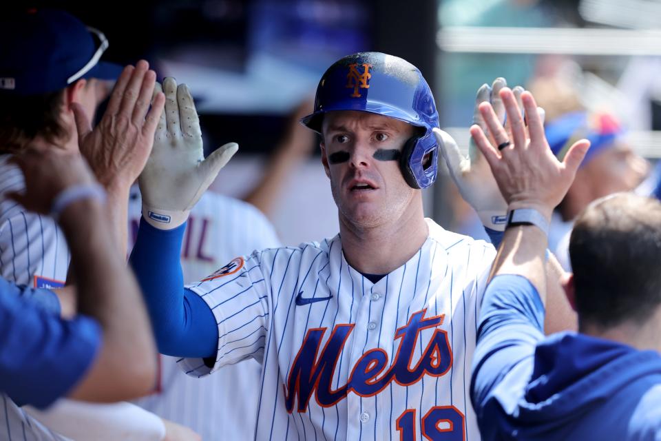 New York Mets left fielder Mark Canha (19) celebrates his two run home run against the Philadelphia Phillies in the dugout with teammates during the fourth inning on June 1, 2023, at Citi Field.