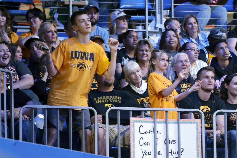 CORRECTS FROM CAITLYN TO CAITLIN - Iowa fans cheer the Indiana Fever and player Caitlin Clark as they play against the Dallas Wings during an WNBA basketball game in Arlington, Texas, Friday, May 3, 2024. (AP Photo/Michael Ainsworth)