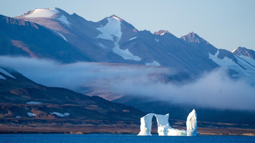 An iceberg floats in the Scoresby Sund, Tuesday, Sept. 12, 2023, in Greenland. (AP Photo/Chris Szagola)