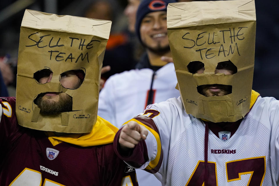 Washington Commanders fans in the stands before an NFL football game between the Washington Commanders and the Chicago Bears in Chicago, Thursday, Oct. 13, 2022. (AP Photo/Charles Rex Arbogast)