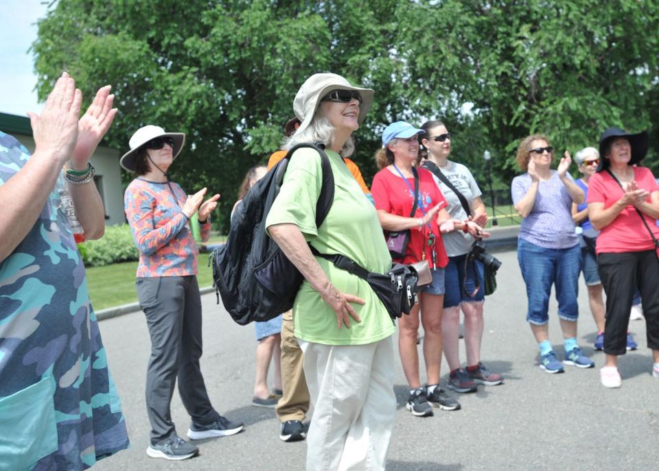 "Happy Birthday" is sung to Quincy Environmental Treasures Program founder Sally Owen, of Quincy, center, on her 75th birthday following a tour of Merrymount Park led by Quincy Mayor Thomas Koch, Sunday, July 9, 2023.