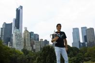 Rafael Nadal of Spain poses with his trophy after winning the men's singles final match against Novak Djokovic of Serbia at the U.S. Open tennis tournament in New York's Central Park, September 10, 2013. REUTERS/Eduardo Munoz (UNITED STATES - Tags: SPORT TENNIS)