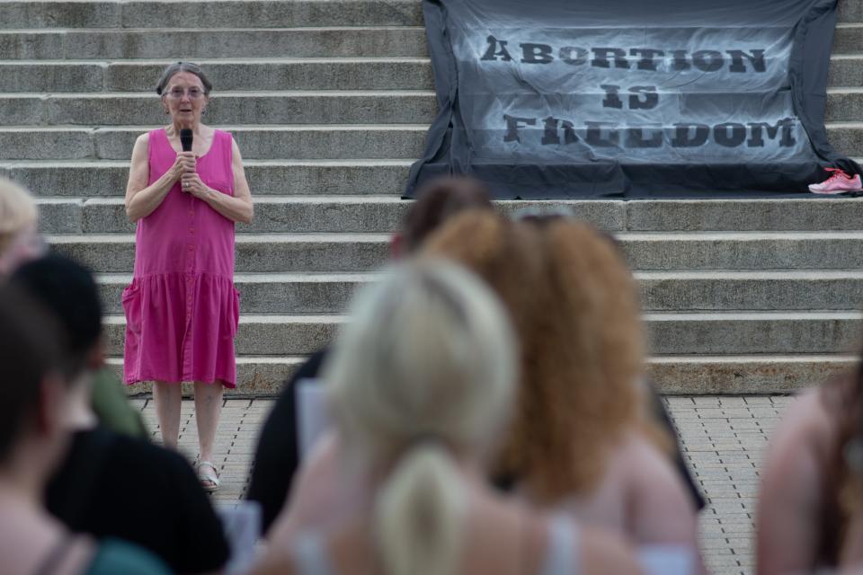 Topekan Sue McKenna shares her dramatic story about life before Roe v. Wade during an abortion-rights rally Friday at the Kansas Statehouse.