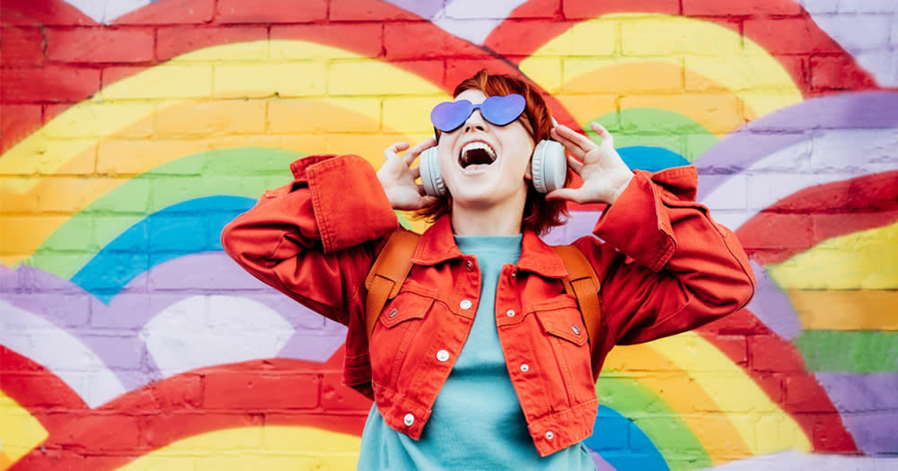 Woman listening to headphones, 'The Sound of Pride'