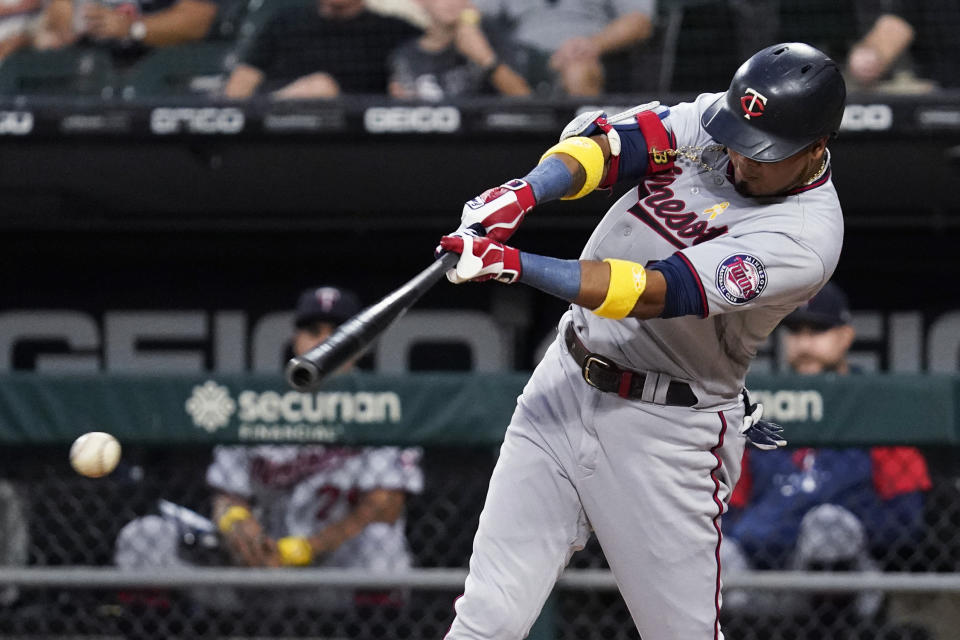 Minnesota Twins' Luis Arraez hits a single during the first inning of the team's baseball game against the Chicago White Sox in Chicago, Friday, Sept. 2, 2022. (AP Photo/Nam Y. Huh)